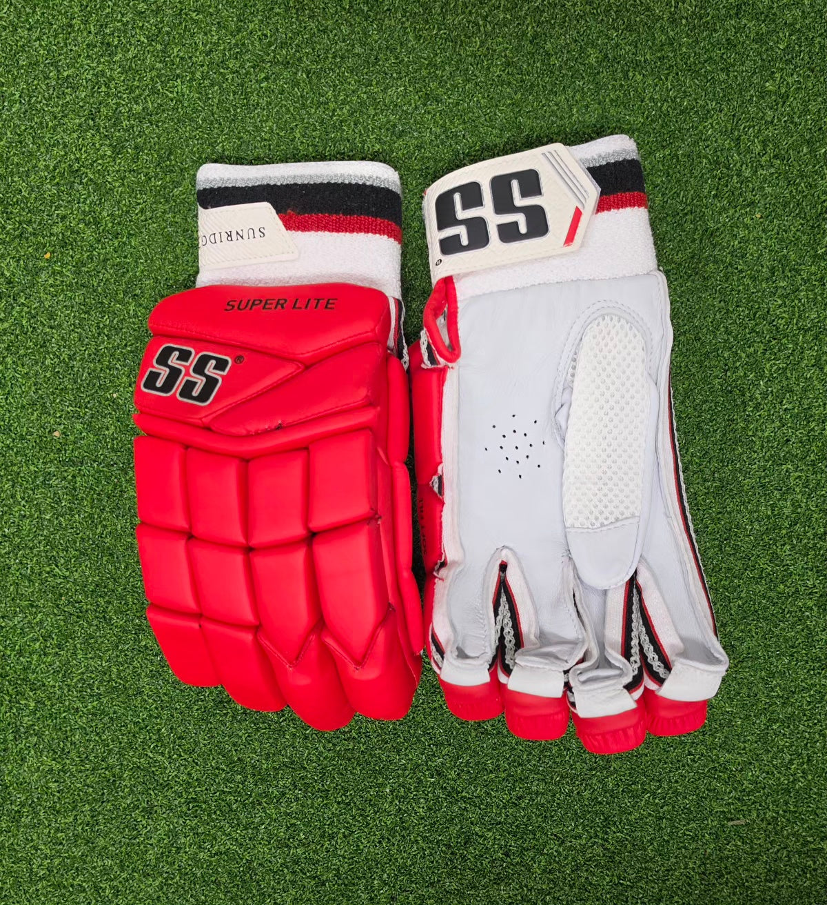Detailed view of SS Superlite cricket batting gloves showcasing the premium leather palm and flexible finger protection blocks.