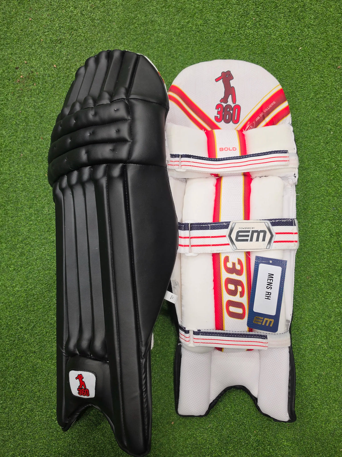 Inner back padded view of EM 360 Bold adult navy blue cricket batting pads on green artificial turf on Alberta.