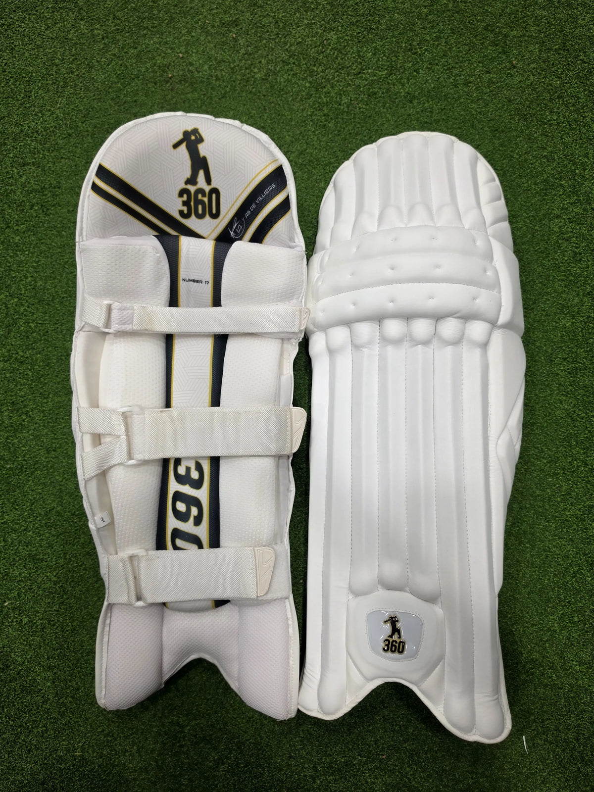 Inner back padded view of EM 360 No 17 adult white cricket batting pads on artificial grass on Alberta.