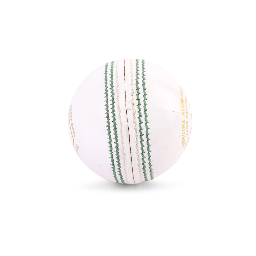 Close-up view of the prominent hand-stitched green seam on a four-piece white SG Club leather cricket ball.