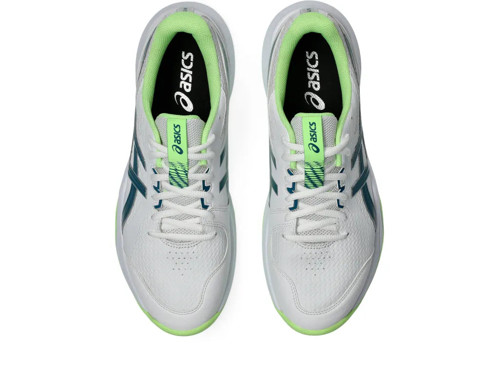 Outsole tread view of the Asics Gel-Peake 3 Rubber Cricket Shoes showcasing bright green multi-directional rubber studs