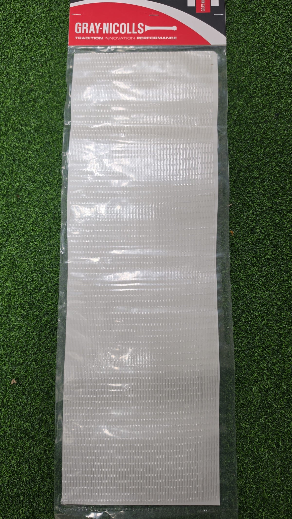 Retail packaging of a protective Gray-Nicolls branded scuff sheet for cricket bats.