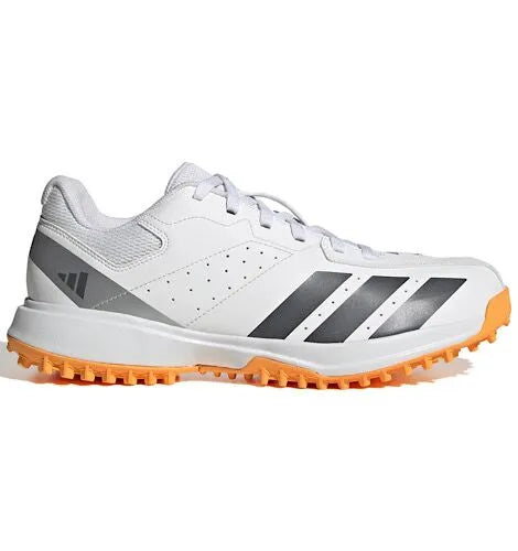 Side profile and orange rubber outsole grid view of Adidas Howzat Spikeless Cricket Shoes from Albertacricketstore.com.