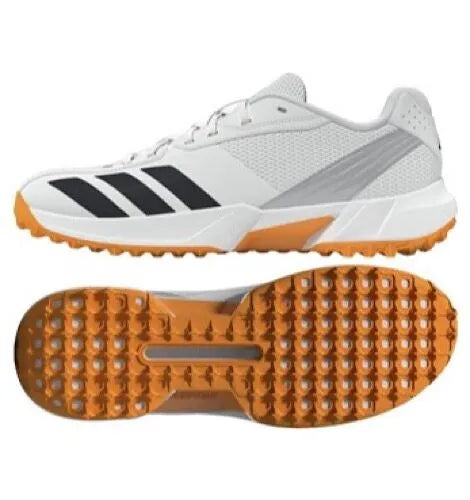 Side view and textured orange rubber outsole view of the white Adidas 22YDS Spikeless Cricket Shoes.