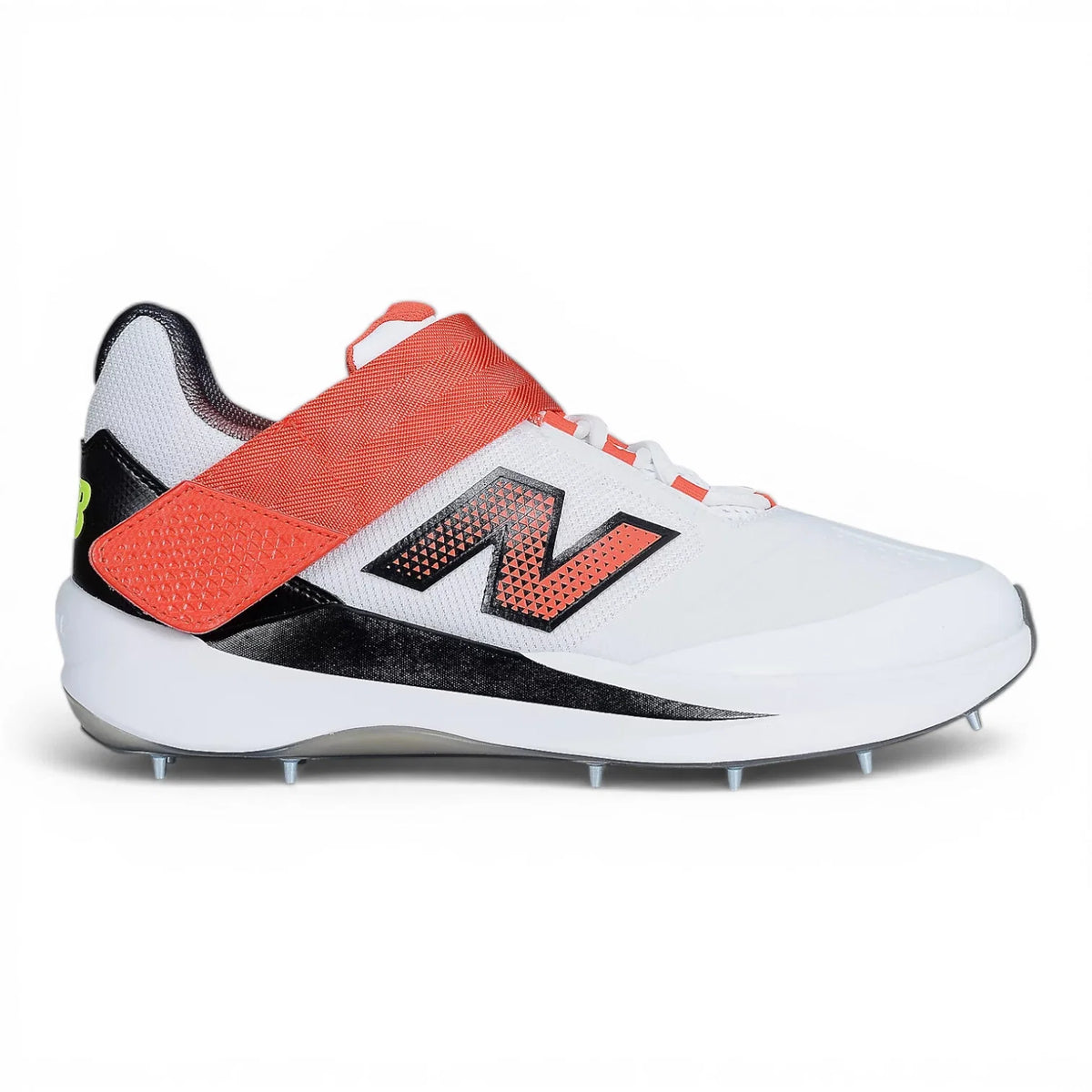 Lateral side view of New Balance CK4040 F7 cricket shoe featuring large black N logo, red midfoot strap, and spiked outsole