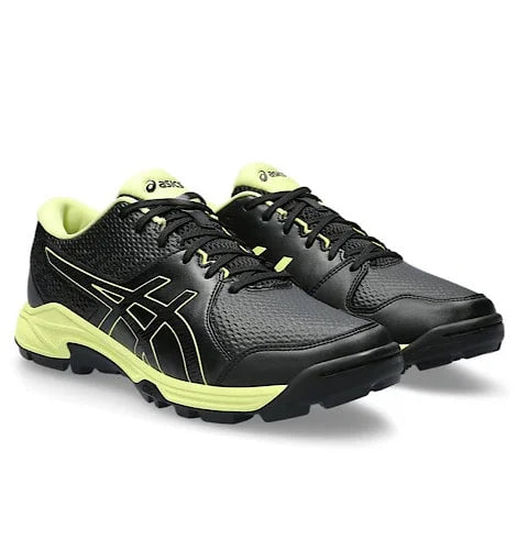 Front three-quarter angle of black Asics Gel-Peake 2 cricket shoes with neon lime trim and sole accents.